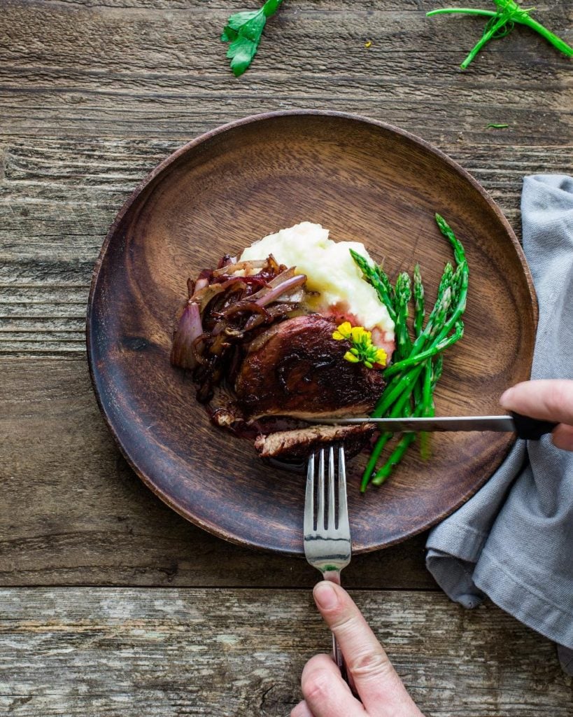 Plant-based meat, mashed potatoes, and green beans