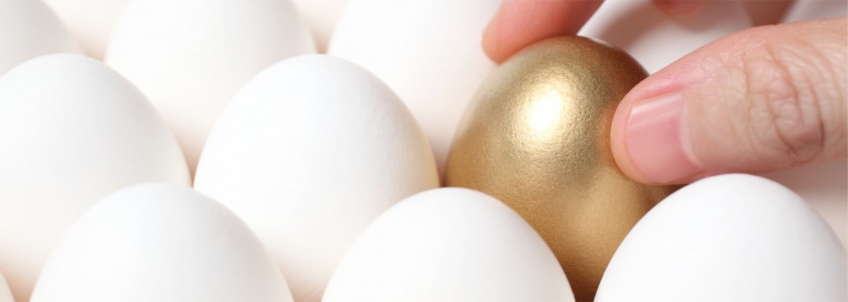 Golden egg amongst white eggs