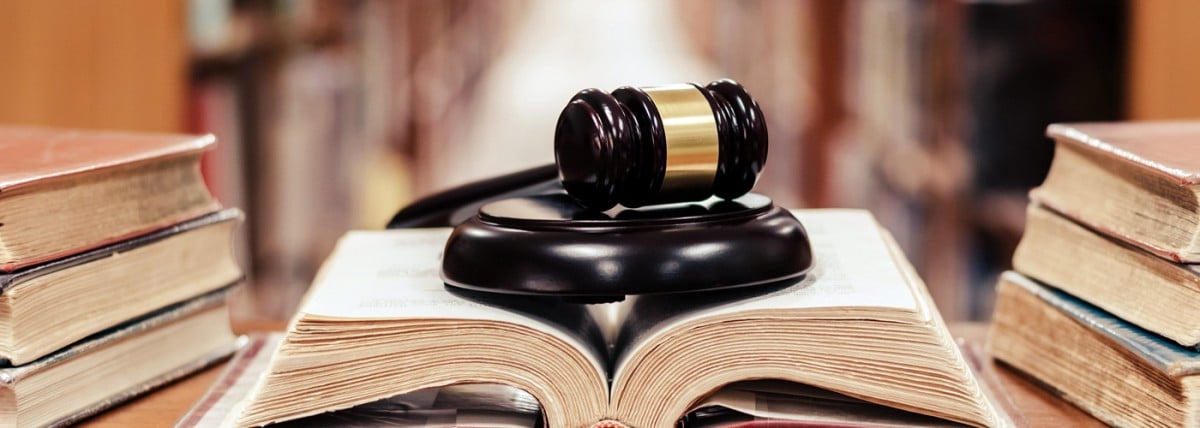 Gavel resting on a large open book