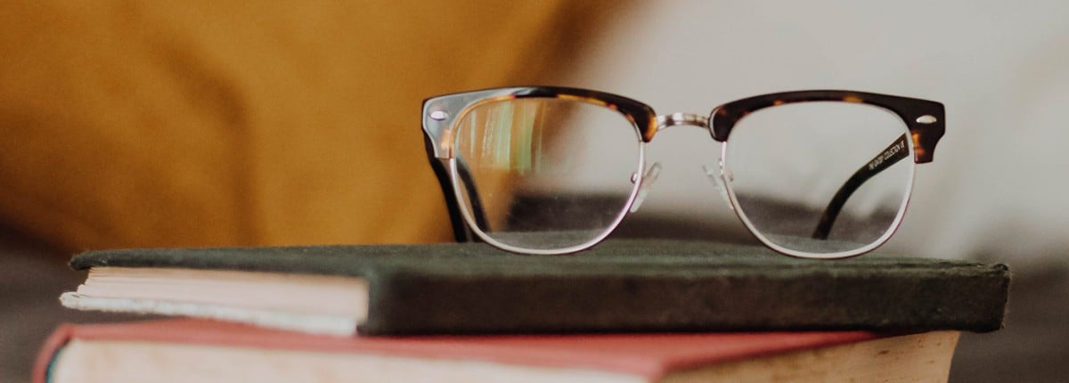 Glasses on a stack of books