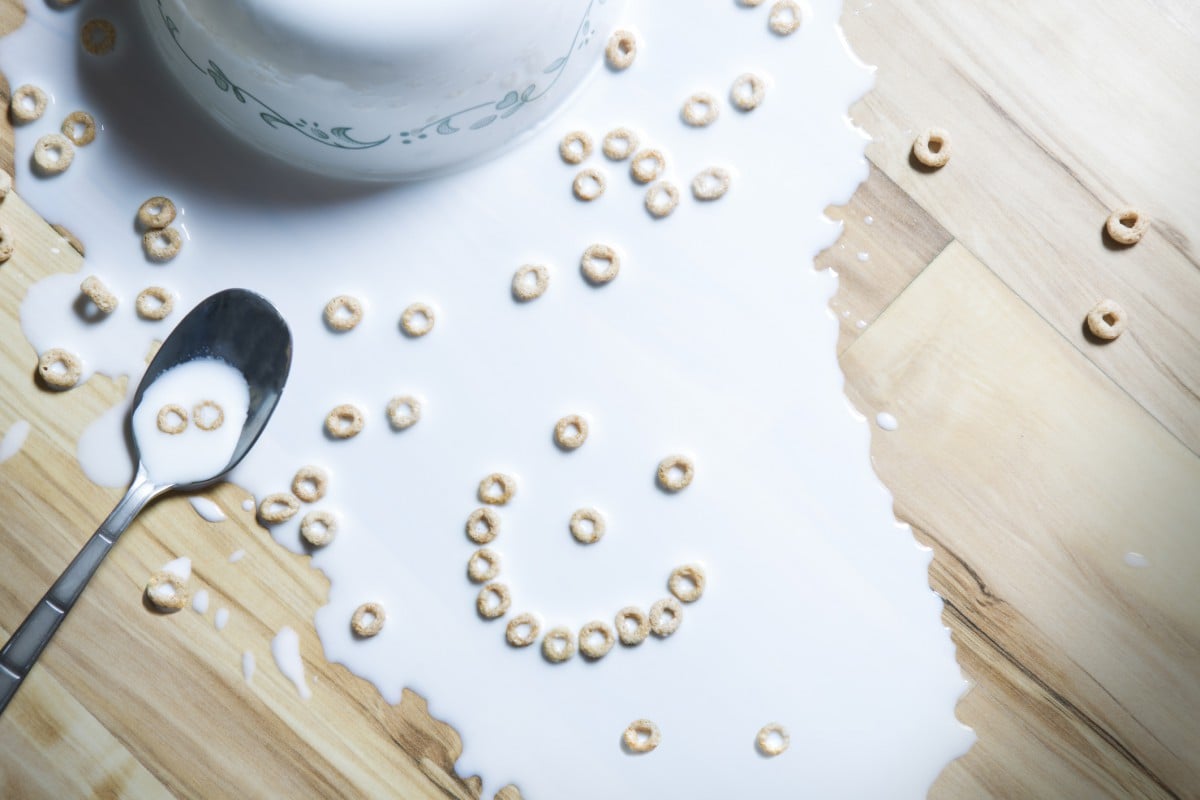 Spilled cheerios and milk with smiley face