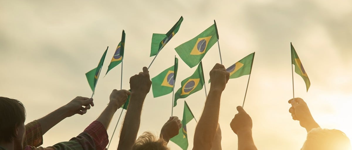 Brazilian flags held in the air