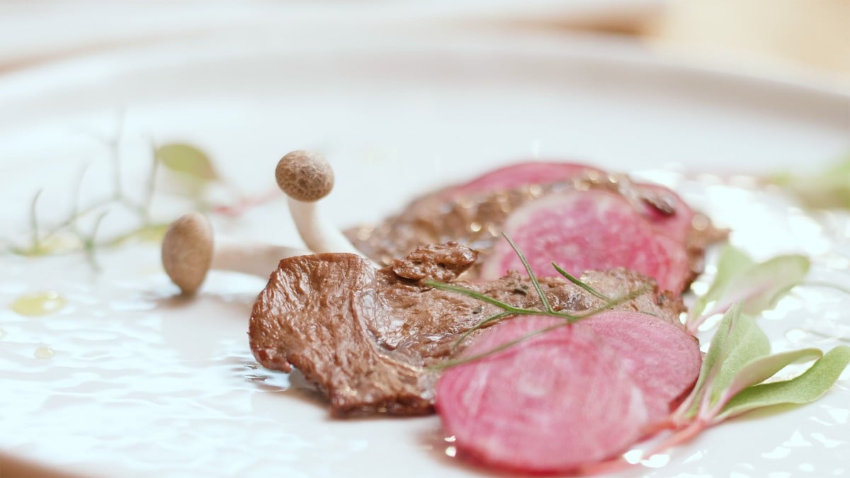 Plant-based meat, mushrooms, and sliced radish