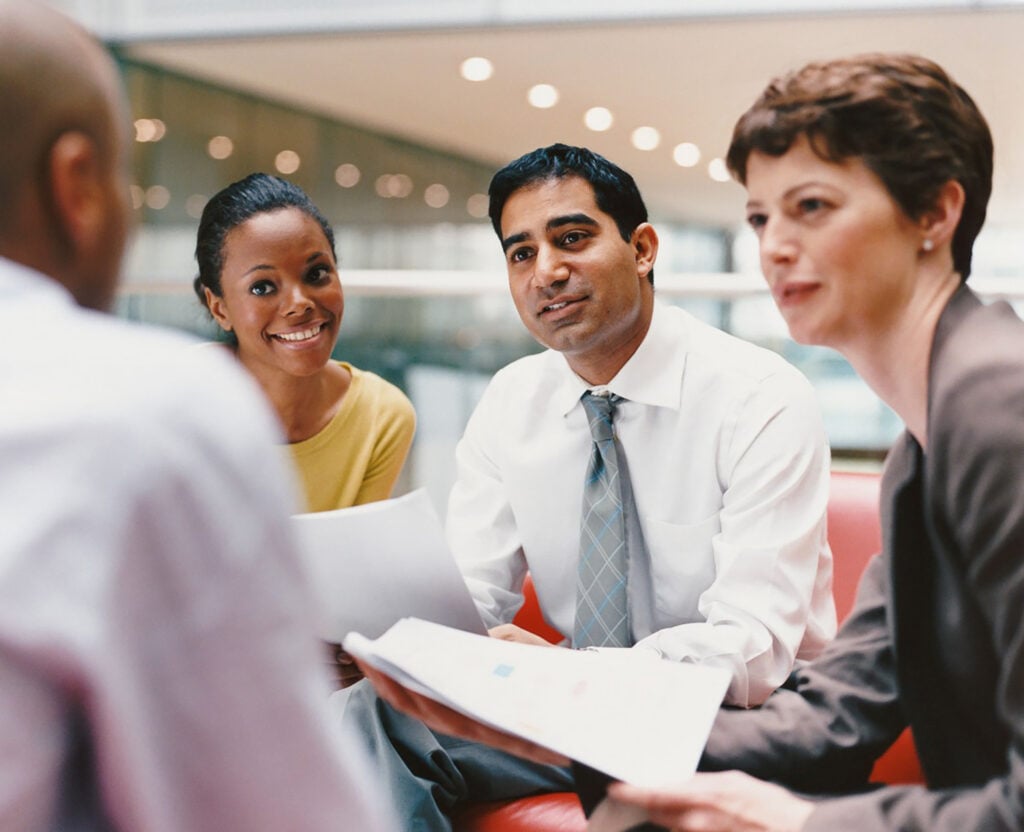 Group of business people discussing investment