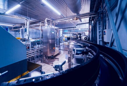 Packaging facility interior with a conveyor belt