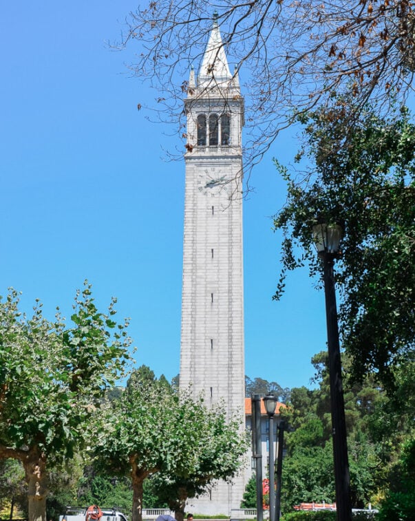 University bell tower against a blue sky