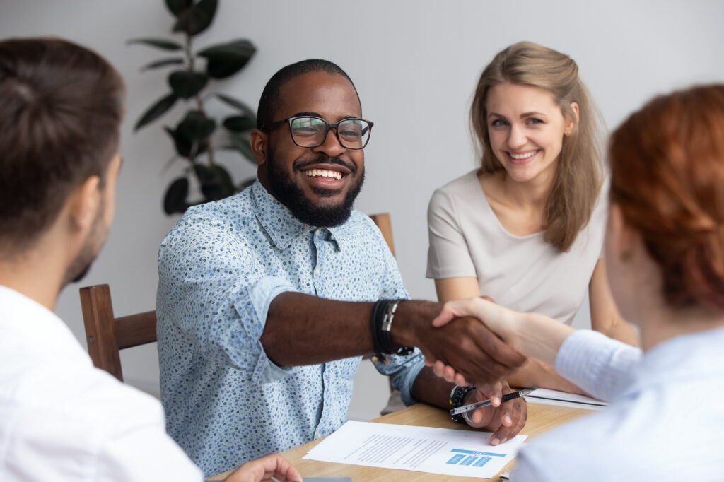 People shaking hands during a business meeting