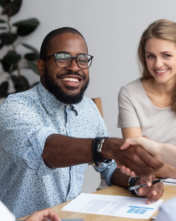 People shaking hands during a business meeting