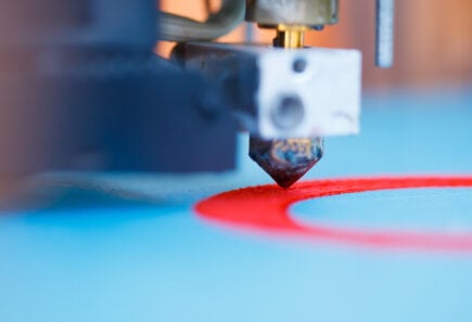 3D printer in action, representing bioprinting concept