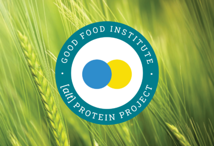 Alt protein project badge on a in front of a field of green wheat