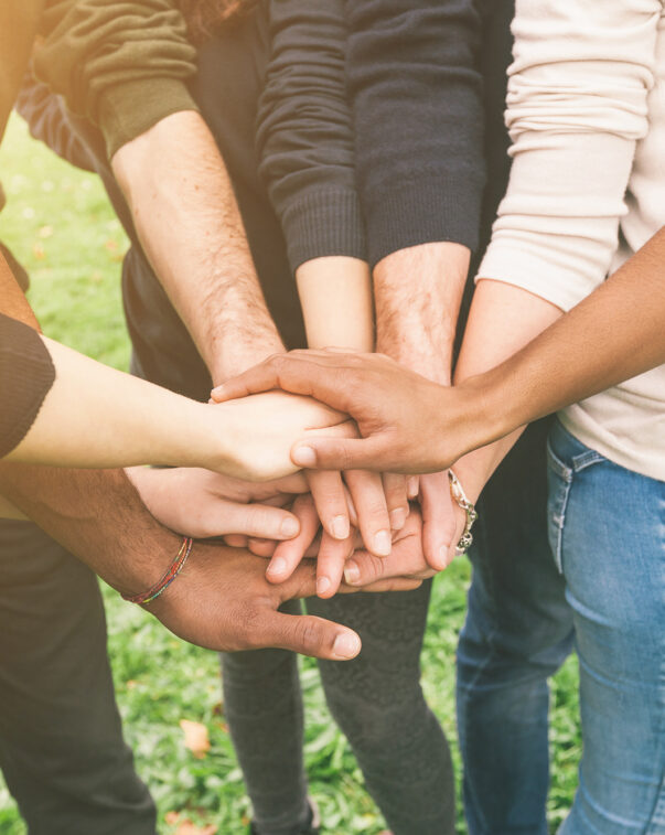 Group of people with hands in stack