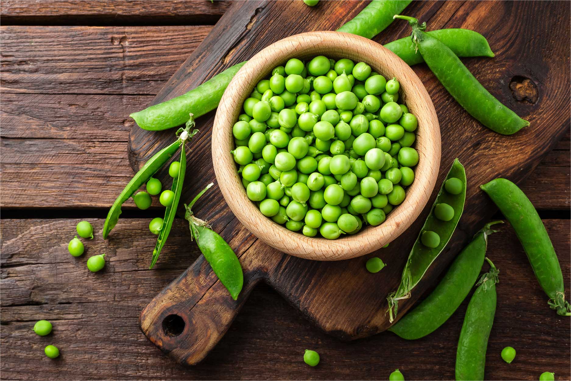 Peas in a wooden bowl