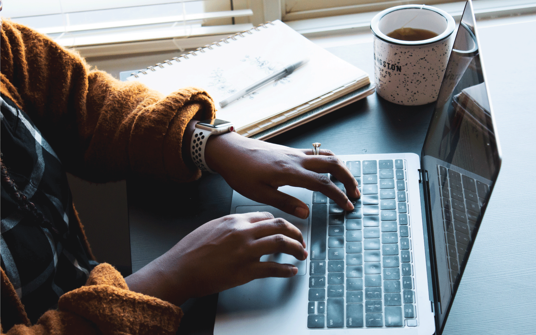 Person typing on laptop