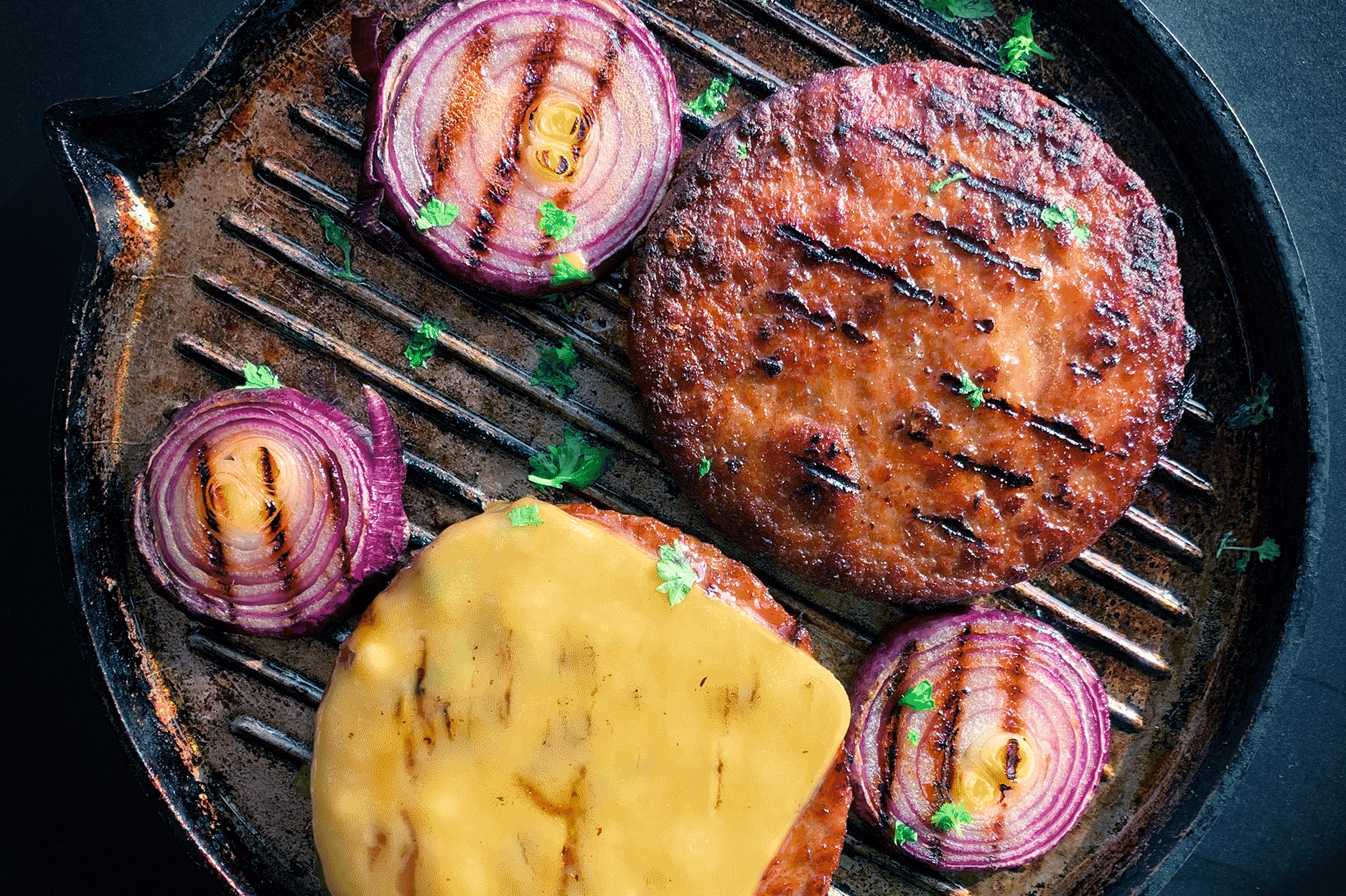 plant-based burgers in a pan