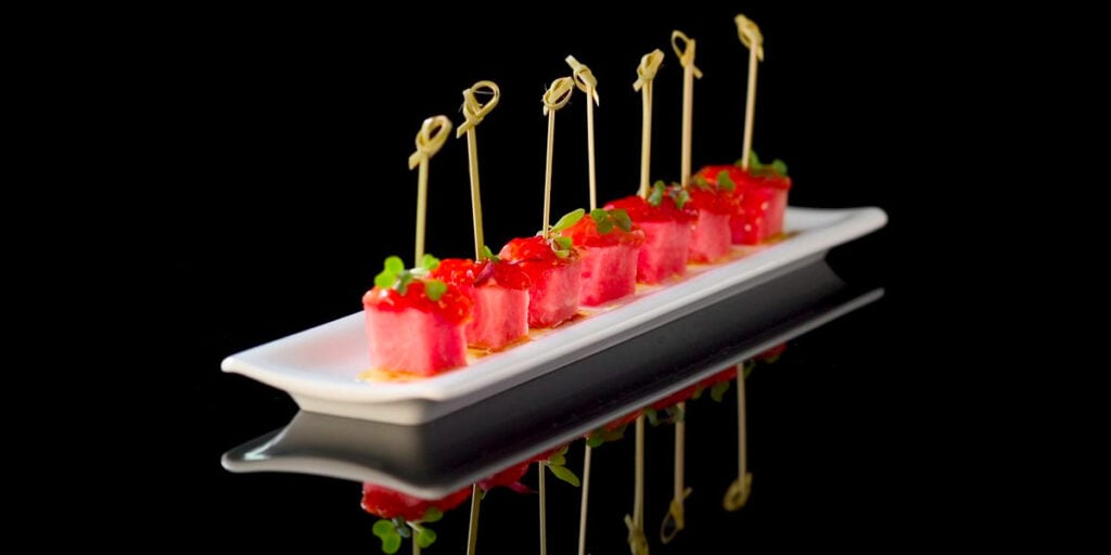 Tomato-watermelon skewers on a plate