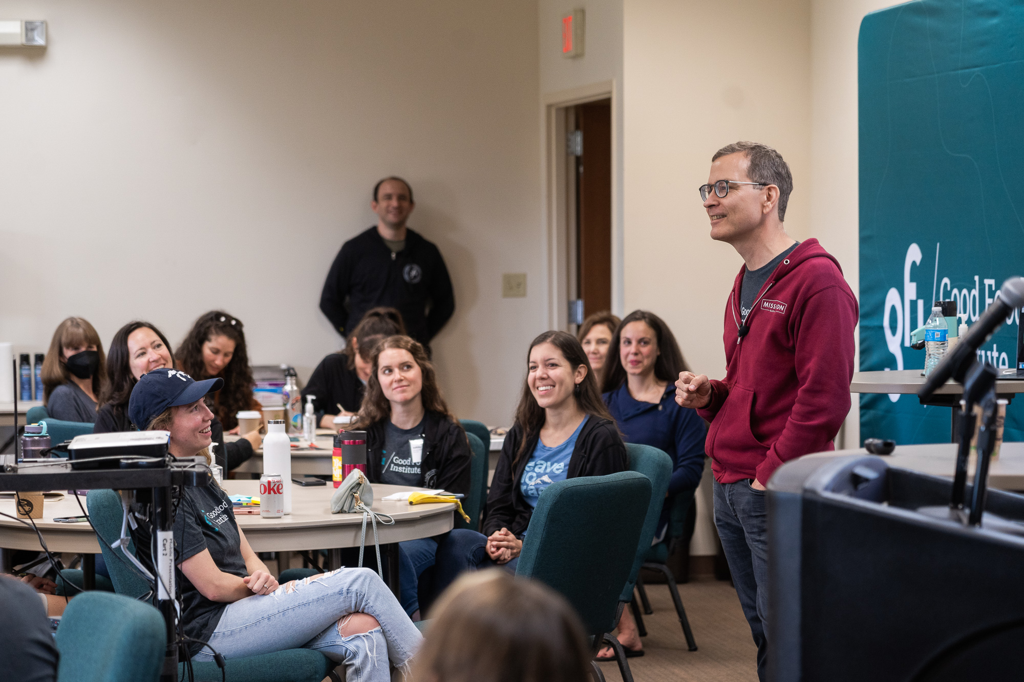 Bruce friedrich addresses a group of gfi staff members