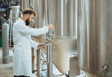 A photo of a scientist working at a bioreactor