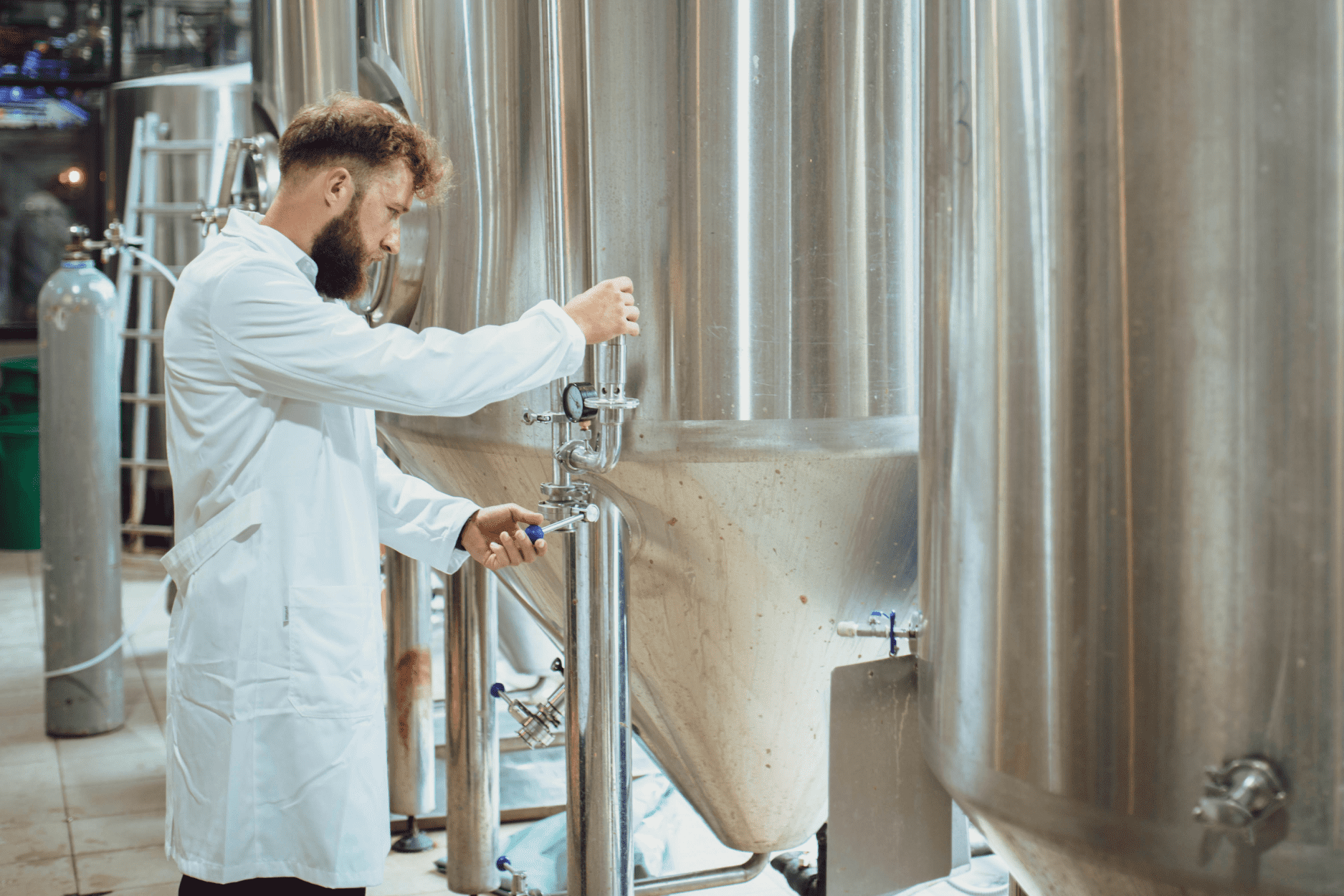 A photo of a scientist working at a bioreactor