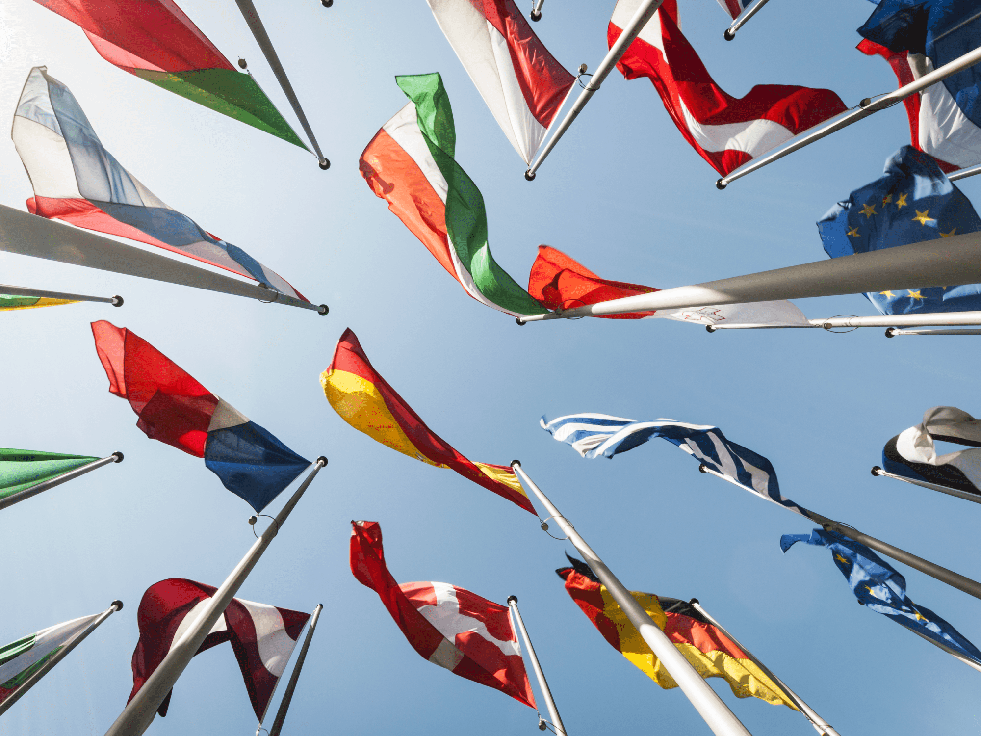 Flags against a blue sky