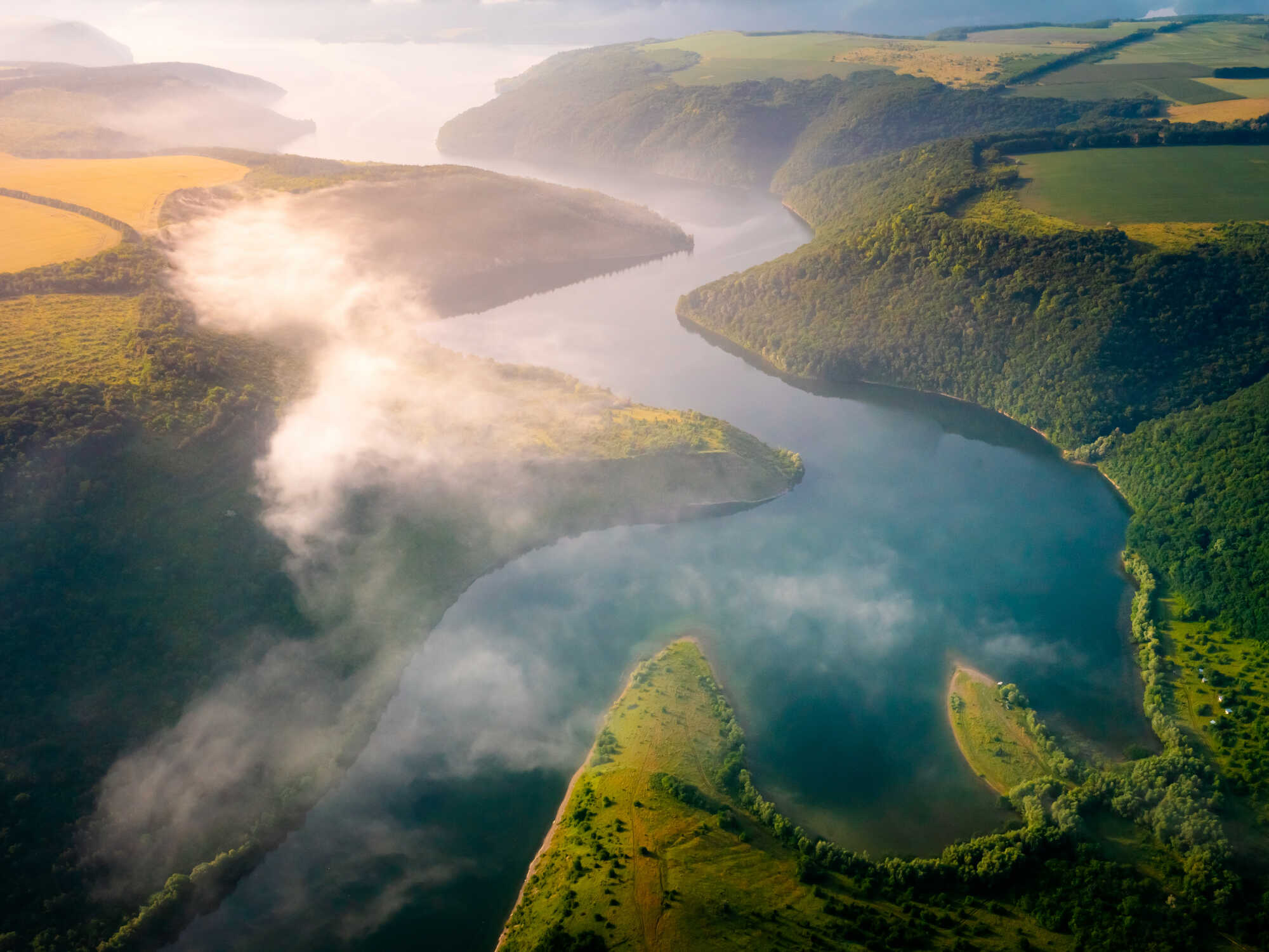 A photo of a scenic mountain and river