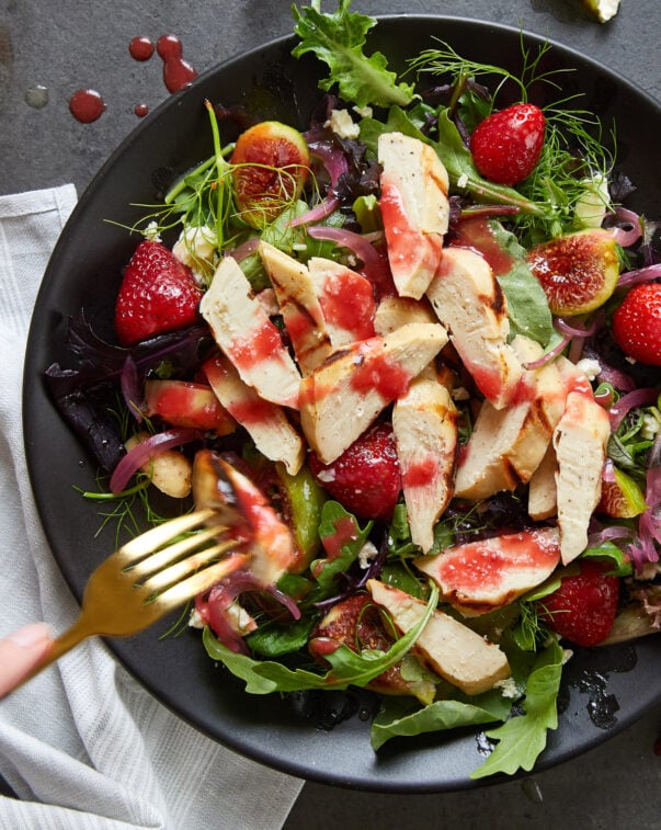 Cultivated chicken cut on a salad from above