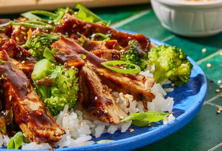 Plant-based chicken with broccoli over rice