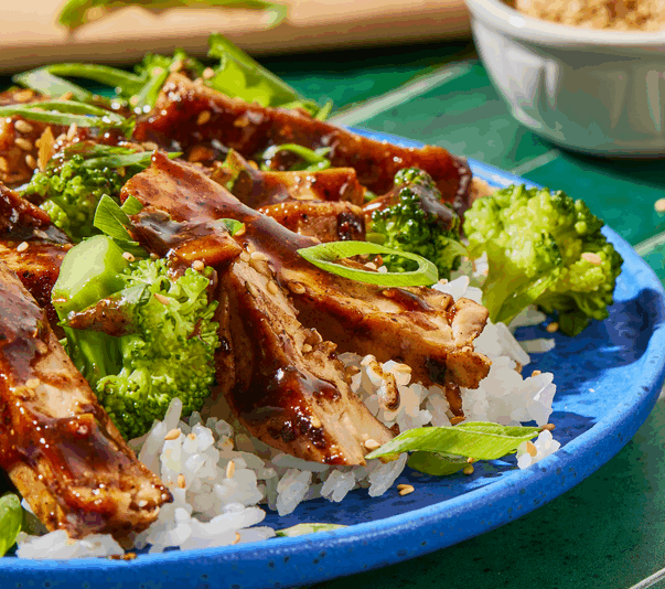 Plant-based chicken with broccoli over rice