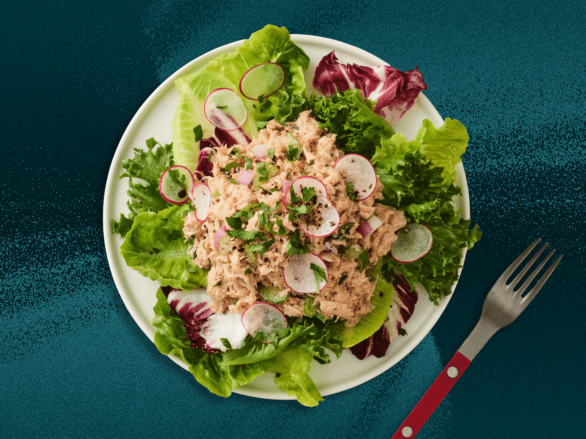 Plant-based chicken salad on a bed of romaine