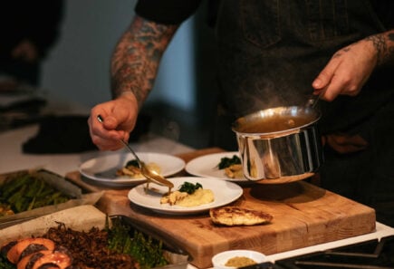 A close up view of a chef preparing a dish