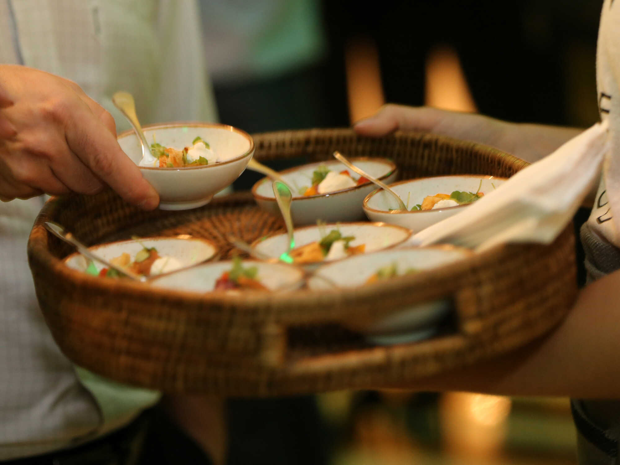 Foodservice communication guide 1 A person holding a tray of plant-based appetizers