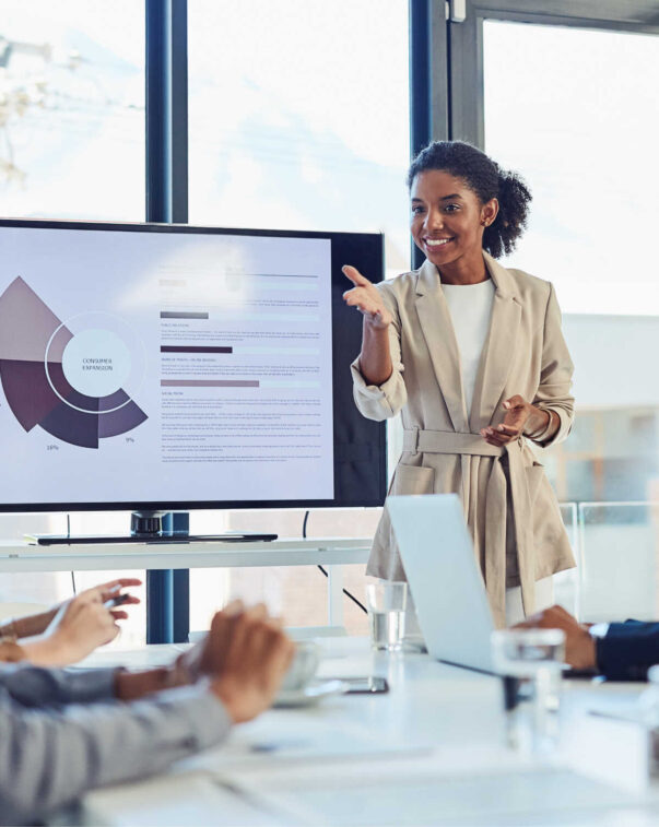 Businesswoman presenting data to colleagues in a meeting