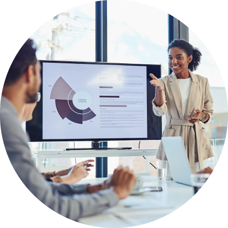 Join our investor directory 1 Businesswoman presenting data to colleagues in a meeting
