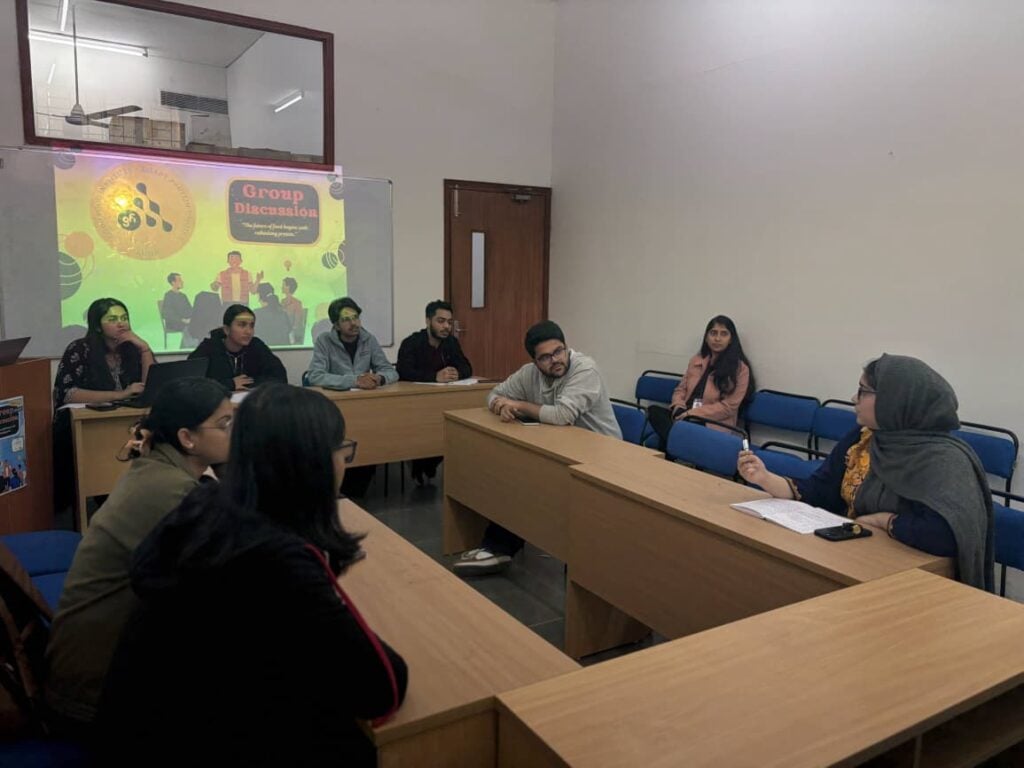 Students exchanging ideas during a smart protein group discussion in a classroom.
