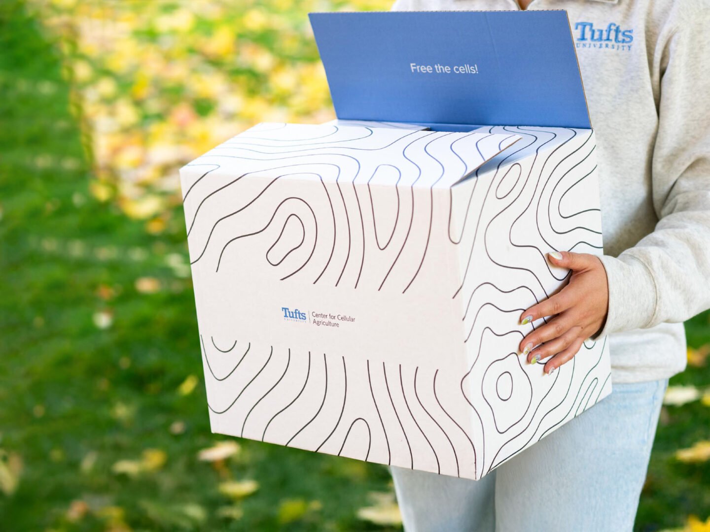 Cultivated meat research just got a major boost. Here’s why it matters. 1 Person holding box with tufts branding