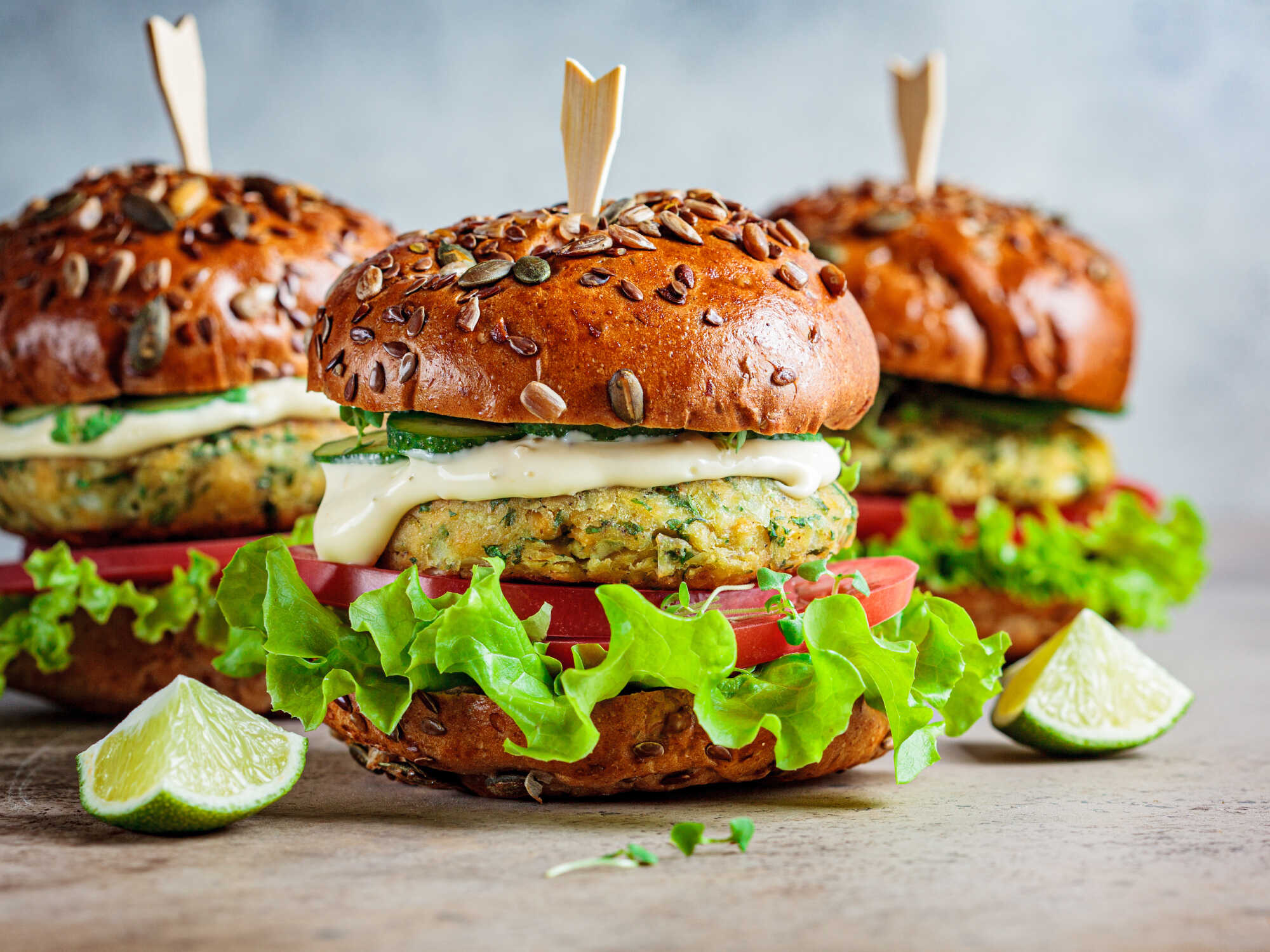 Close up of veggie burgers with vegetable toppings