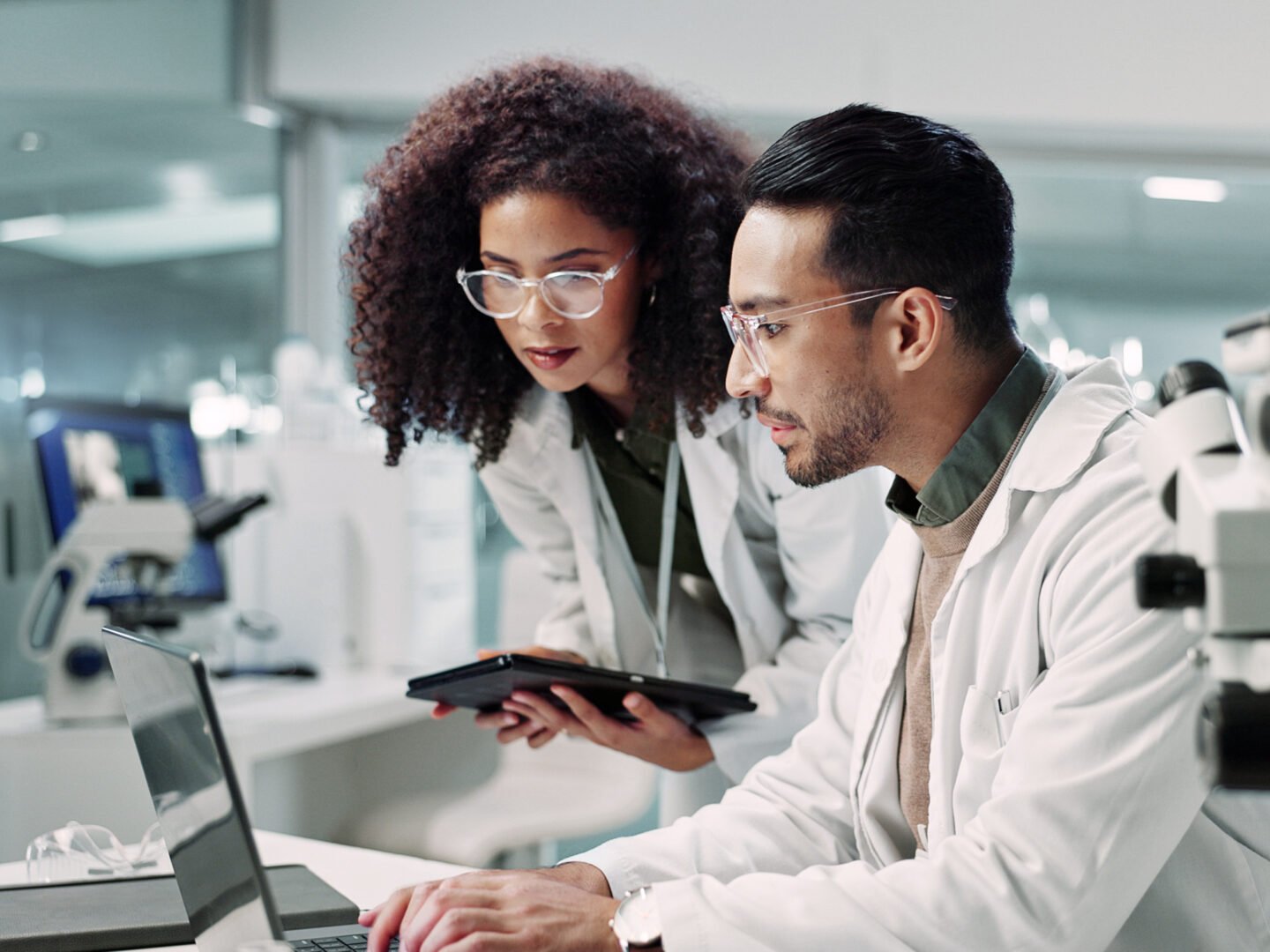 Two researchers looking at data