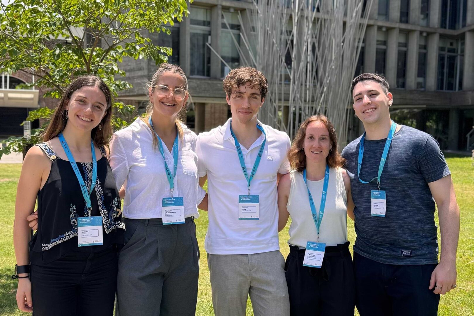 Five college students standing together and smiling at the camera.  photo credit: inés macetti.