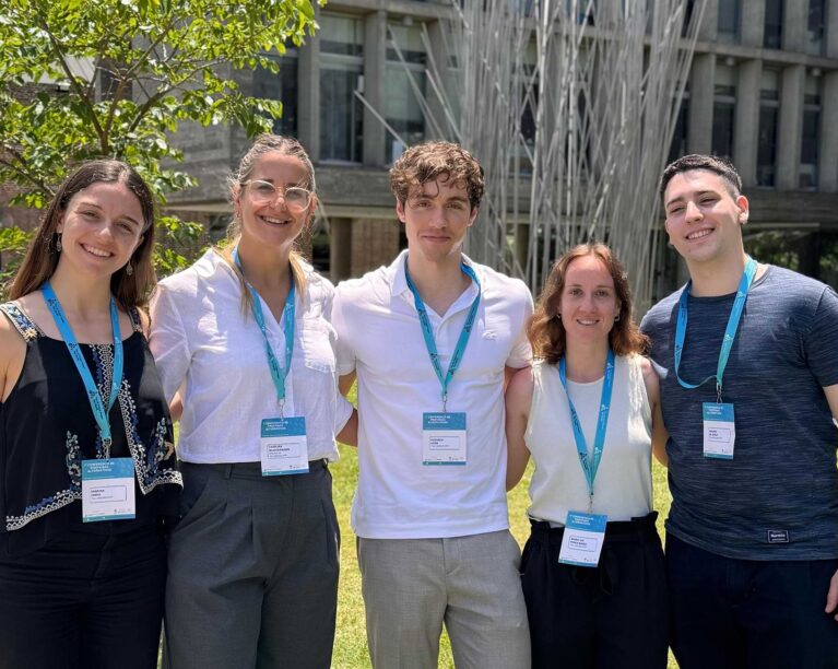 Five college students standing together and smiling at the camera.  photo credit: inés macetti.