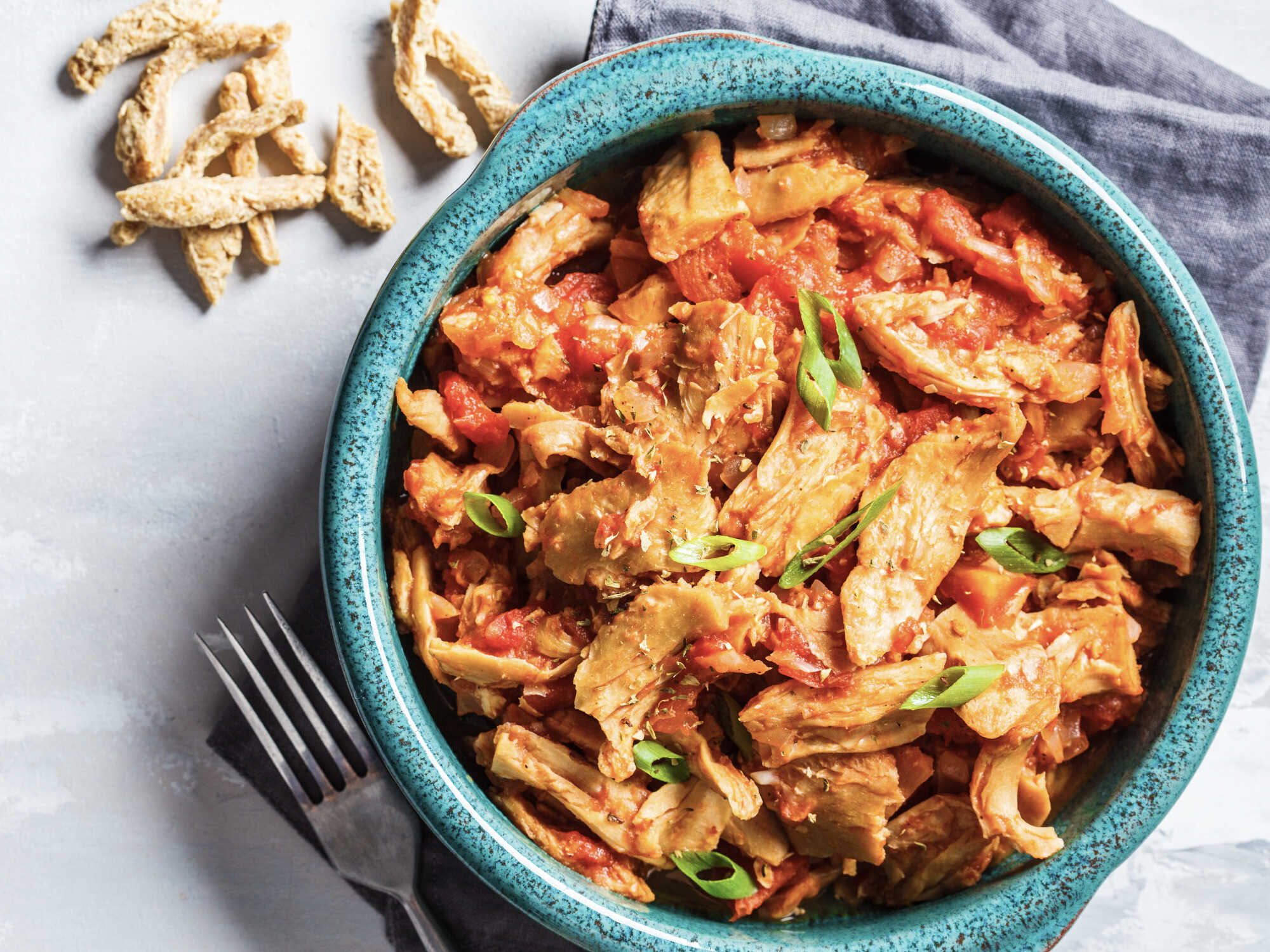 Plant-based chicken in a bowl with vegetables