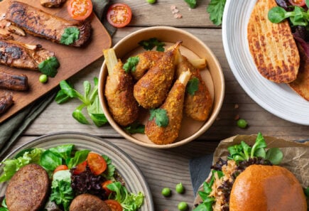 Top down view of a variety of plant based food and condiments on a table