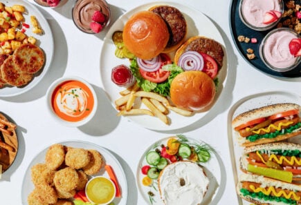 Top down view of a variety of plant based food and condiments on a table
