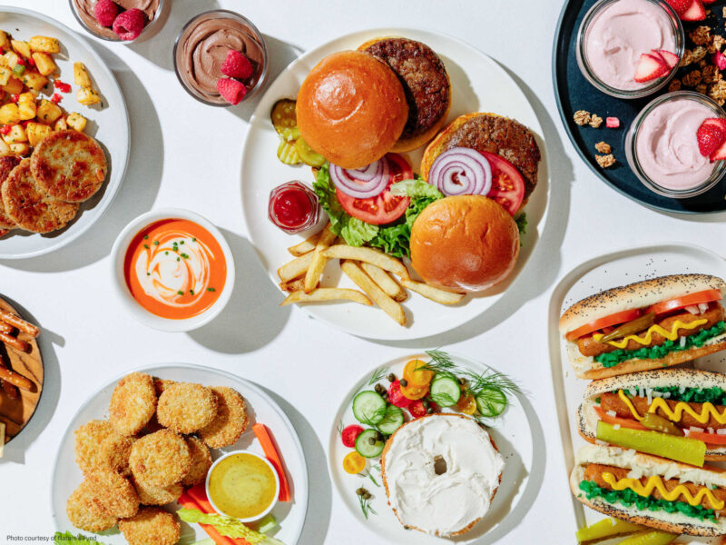 Top down view of a variety of plant based food and condiments on a table
