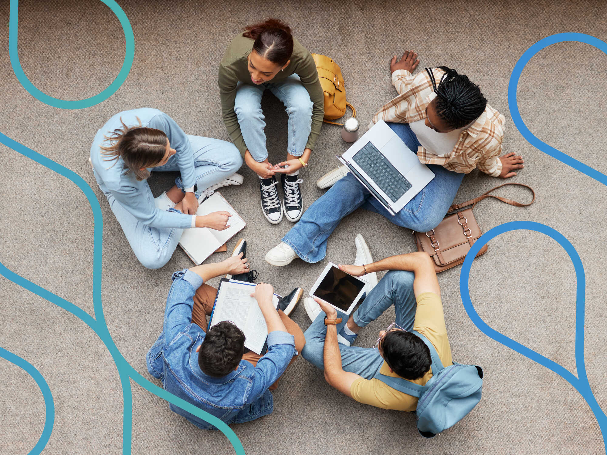 A group of students sitting together working on laptops